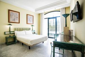 Postel nebo postele na pokoji v ubytování AZZ Mérida Medea Hotel