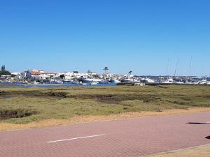 a parking lot with a marina with boats at Casa en Punta Del Moral in Isla del Moral