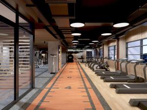 an empty gym with rows of chairs and a long aisle at Mövenpick Hotel Jakarta City Centre in Jakarta