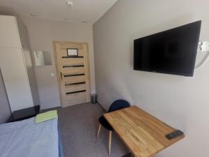 Televízia a/alebo spoločenská miestnosť v ubytovaní Bemma Apart Hostel + 37 fotografií