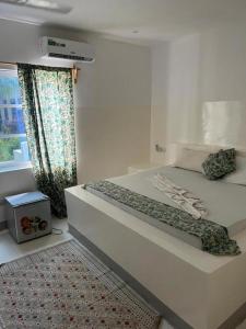 En eller flere senge i et værelse på Varadero Zanzibar Hotel