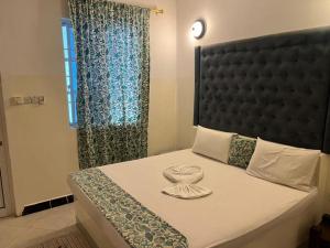 Postel nebo postele na pokoji v ubytování Varadero Zanzibar Hotel
