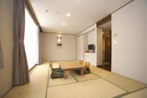 a dining room with a table and chairs at TOYOTA Shirakawa-Go Eco-Institute in Shirakawa