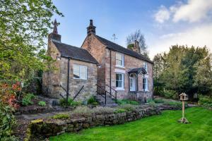 an old brick house with a garden in front of it at Finest Retreats - Spring Cottage in Endon