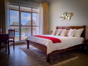 Postelja oz. postelje v sobi nastanitve Coral Cliff Villas Zanzibar