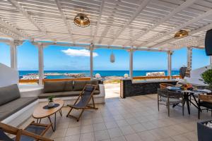 a living room with a view of the ocean at Gabriel House in Monolithos