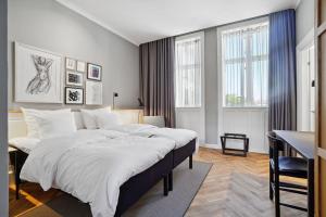 Postel nebo postele na pokoji v ubytování Hotel Kong Arthur