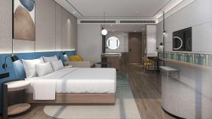 1 dormitorio con 1 cama y sala de estar en Hilton Garden Inn Taiyuan Binhe, en Yangjiabu