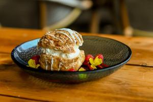 a black bowl with a pastry on a wooden table at Sweeney Hall Hotel in Oswestry