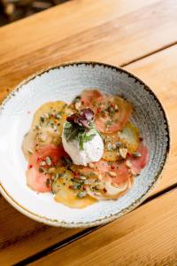 a bowl of food on a wooden table at Sweeney Hall Hotel in Oswestry