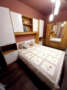 a bedroom with a large bed in a room at Аpartment Van Gogh in Hisarya +11 photos