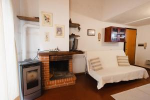 a living room with a couch and a fireplace at Dimora Annilor Castel di Sangro in Castel di Sangro