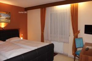 Postel nebo postele na pokoji v ubytování Legend Hotel