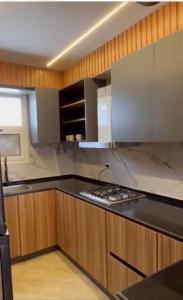 a kitchen with a stove and a counter top at شاليه في امواج amwaj in El Alamein