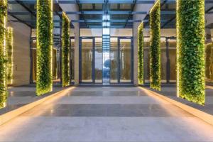 an office building with a vertical garden on the walls at Luxurious Saifi 477, 2-BR Apt in Beirut