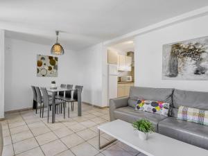 a living room with a couch and a table at Apartment Muga-2 by Interhome in Empuriabrava