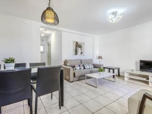 a living room with a couch and a table at Apartment Muga-2 by Interhome in Empuriabrava