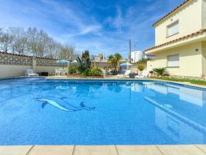 a swimming pool with a dolphin painted on it in a house at Apartment Muga-2 by Interhome in Empuriabrava