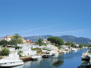 a group of boats are docked in a river at Apartment Muga-2 by Interhome in Empuriabrava