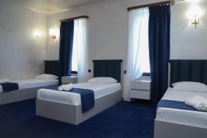 Voodi või voodid majutusasutuse Central hotel toas