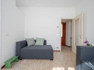 a living room with a couch and a table at Holiday Home Trekking House by Interhome in Mergozzo