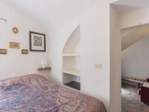 a bedroom with a bed and a book shelf at Holiday Home Casa Pinela Maria Sole by Interhome in Castellaro