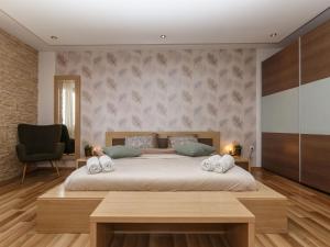 Postel nebo postele na pokoji v ubytování Holiday Home Maro by Interhome