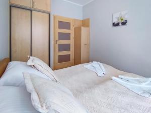 Łóżko lub łóżka w pokoju w obiekcie Casa Marina Spa by Baltic Home