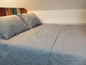 a bed with a pillow on top of it at Gaviotas Beach Golf Love 11 in Almerimar +30 photos