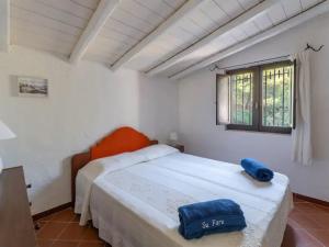 Postel nebo postele na pokoji v ubytování Holiday Home 'Su Faru' estate-5 by Interhome