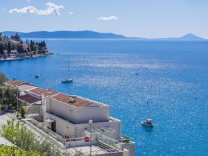 a building on the water with boats in it at Apartment Acqua e sale by Interhome in Rabac