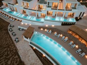 an aerial view of a resort with a swimming pool at Mykonos Flow - Super Paradise in Super Paradise Beach