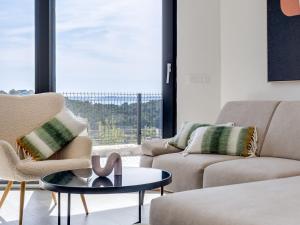 a living room with two couches and a table at Apartment Minimalist by Interhome in Šibenik