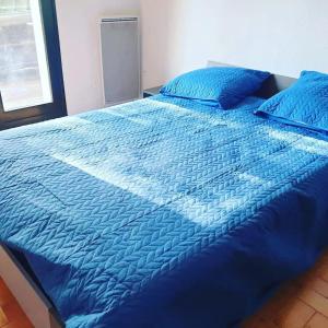 Postel nebo postele na pokoji v ubytování Gite au Rocher + 12 fotografií