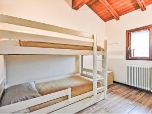 a group of bunk beds in a room at Chalet La Quiete Mountain Home by Interhome in Sacco
