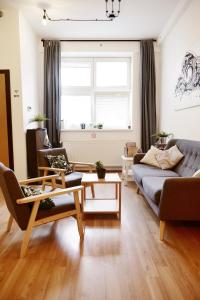 a living room with a couch and a table at Schöndorf Hostel - virtual reception in Bratislava +45 photos