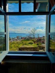 a window view of the ocean from a house at Cheers Vintage Hostel in Istanbul