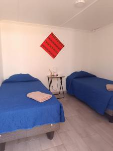 Ein Bett oder Betten in einem Zimmer der Unterkunft Misky Wasi