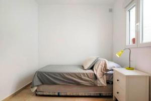 Postel nebo postele na pokoji v ubytování Apartamentos ALAZUL Extramuros
