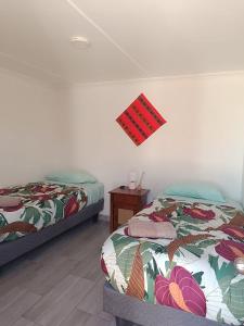 Ein Bett oder Betten in einem Zimmer der Unterkunft Misky Wasi