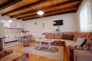 a living room with a couch and a table at Omni S Apartments in Bar