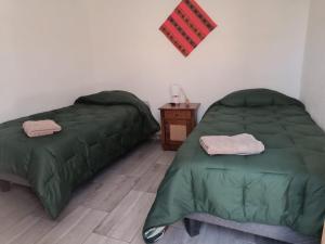 Ein Bett oder Betten in einem Zimmer der Unterkunft Misky Wasi