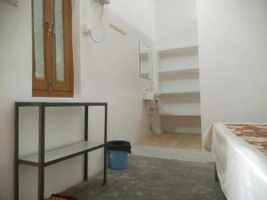 Ένα ή περισσότερα κρεβάτια σε δωμάτιο στο Rashi home stay