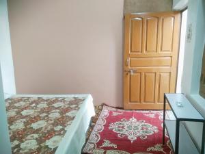 Ένα ή περισσότερα κρεβάτια σε δωμάτιο στο Rashi home stay