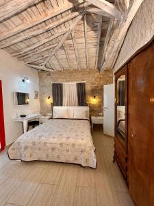 a bedroom with a large bed in a room at Köşem Konukevi in Alaçatı