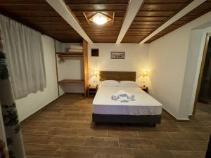 Postel nebo postele na pokoji v ubytování Xinovrissi Apts & Pool