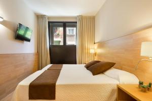 Posteľ alebo postele v izbe v ubytovaní Hotel Acta Azul Barcelona