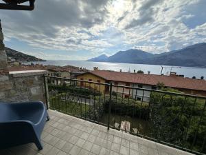 a balcony of a house with a view of the water at Casa Di Tino by GadraDoma in Assenza di Brenzone
