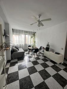 a living room with a black and white checkered floor at Habitación 3 - 3 planta sin ascensor in Fuengirola