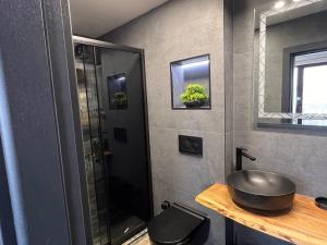 a bathroom with a sink and a glass shower at Saint George - Old Nesebar in Nesebar +34 photos